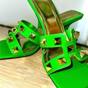 I am selling some nice elegant green heels with gold rhinestones in the front